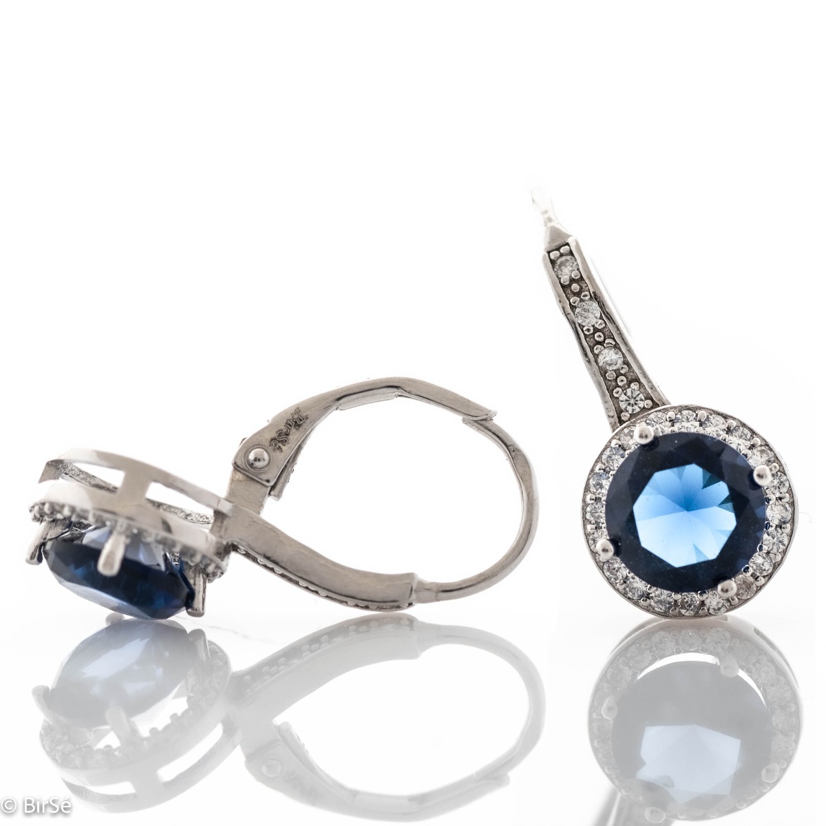 Extremely fine sterling silver earrings with a willow clasp and precise, slightly dangling craftsmanship, combining rhodium-plated silver with sparkling zircons and sapphires.