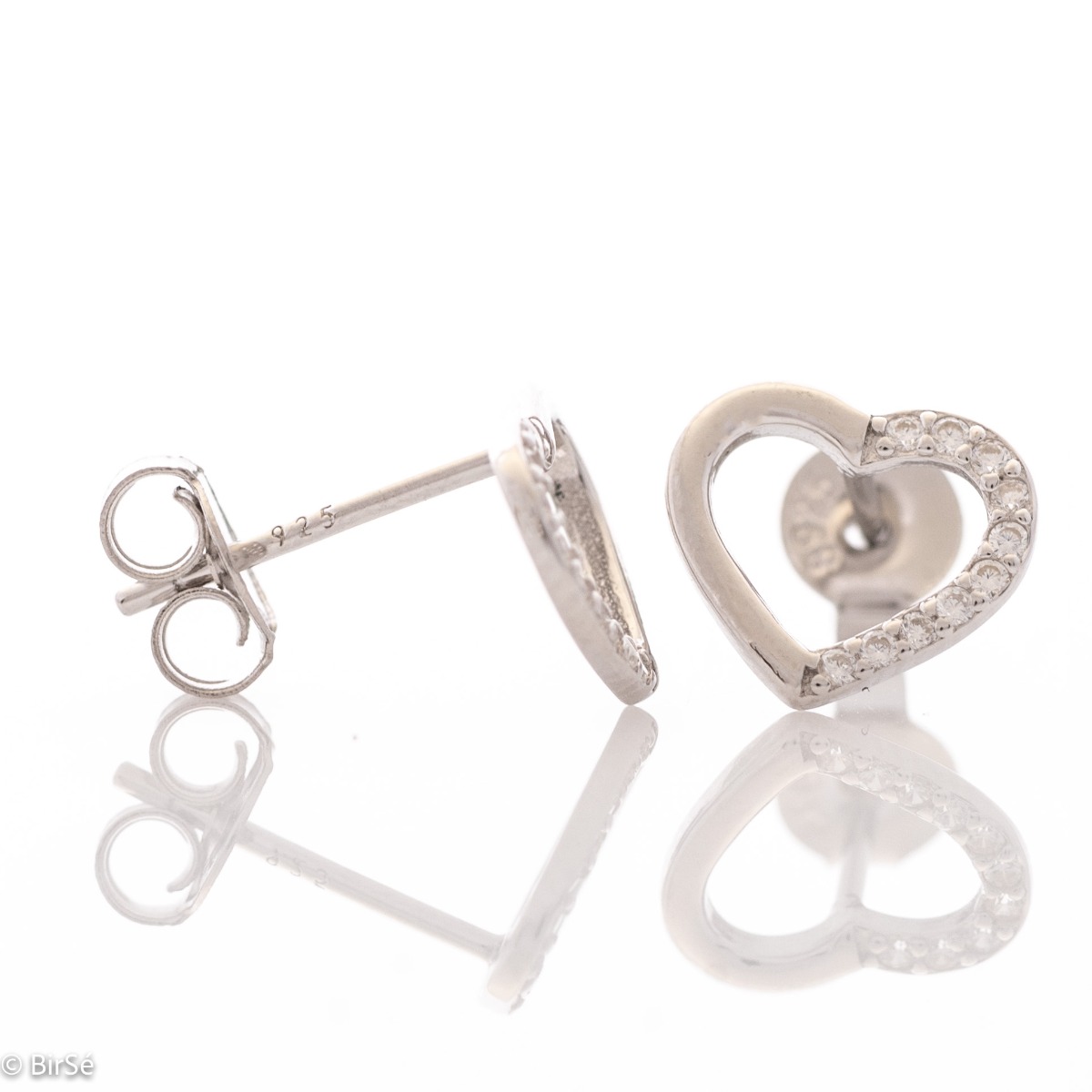 Beautiful and simple heart earrings made of rhodium silver, elegantly decorated with zircons. Pin fastening for convenience and security. They go well with silver jewelry with zircons.