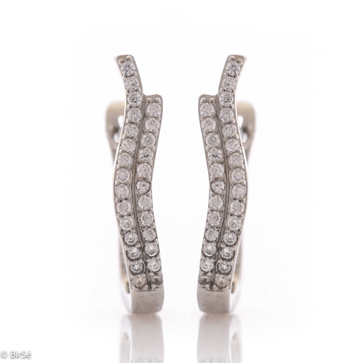 Elegant women's earrings with a spectacular design. Made entirely of rhodium-plated silver, with a comfortable English clasp and an extravaganza of sparkling zircons. Suitable for every day and any occasion.