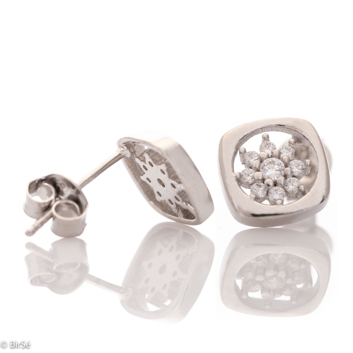 Charming earrings in fine rhodium silver, with delicate precision craftsmanship and an extremely spectacular pattern with a flower of zircons. Earrings are a suitable piece of jewelry for a daily outfit or for a special occasion.