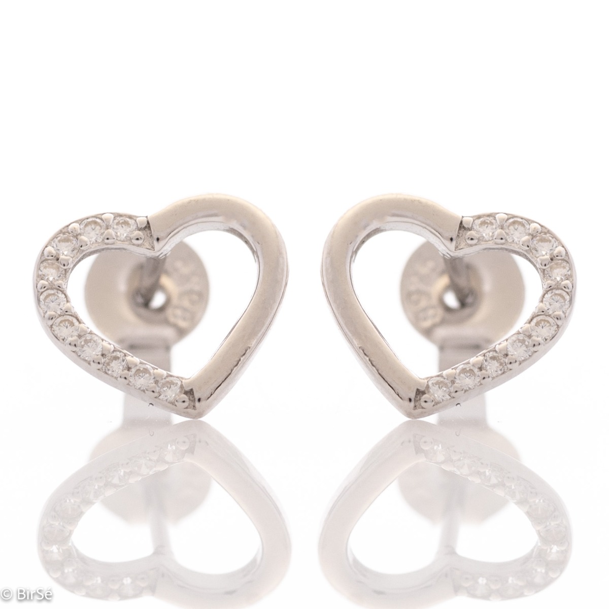 Beautiful and simple heart earrings made of rhodium silver, elegantly decorated with zircons. Pin fastening for convenience and security. They go well with silver jewelry with zircons.