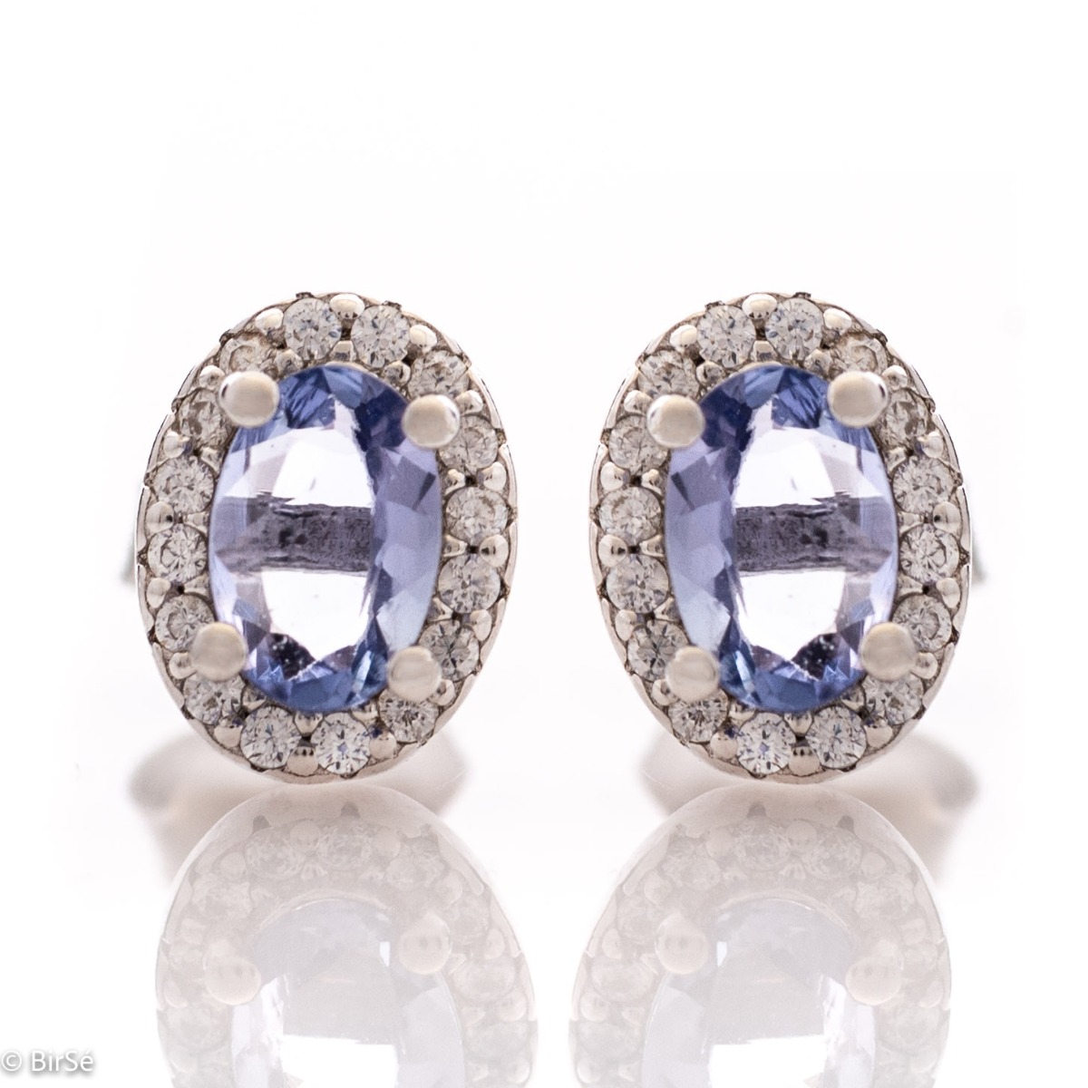 Royal vision - stunning silver earrings with a spectacular look and stud fastening. An elegant composition made of a fine combination of rhodium-plated silver with exquisite tanzanite and dazzling zircons.