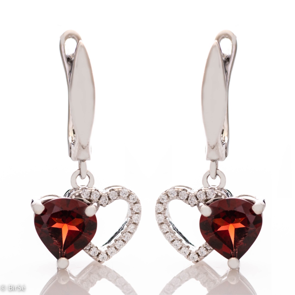 Delicate dangle earrings with sparkling natural garnet combined with beautiful rhodium silver and fine sparkling zircons. Elegant design with comfortable English fastening. Complete with a ring with the same charming design.