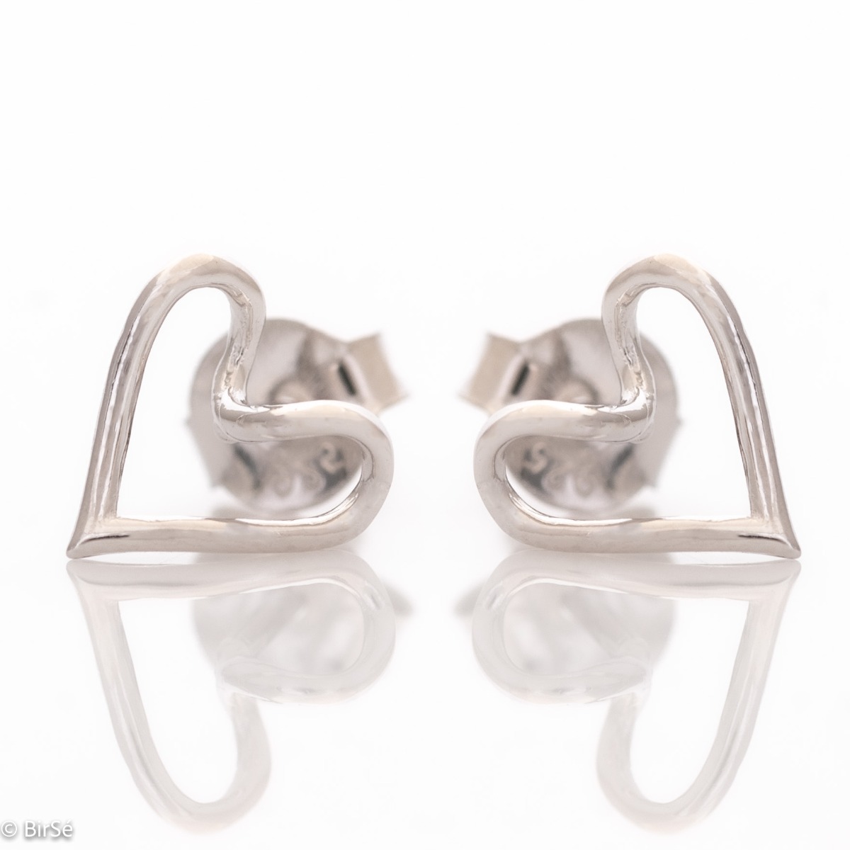 Delicate ladies' earrings made of fine rhodium-plated silver, shaped like a wire, from which a pair of lovely hearts are masterfully made. The earrings are fastened with a pin - extremely comfortable and practical. A suitable gift for any woman in love.