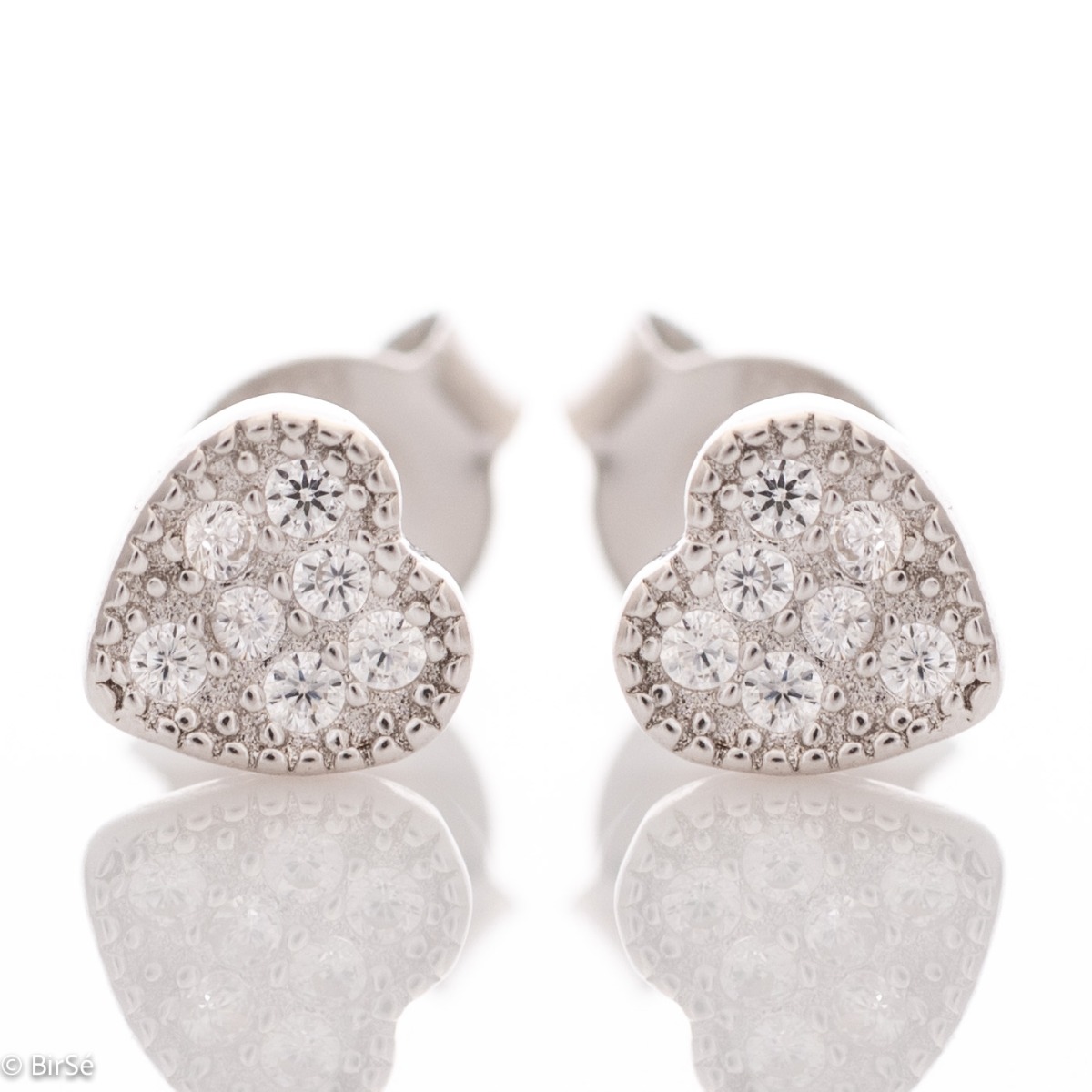 Charming women's heart earrings, masterfully crafted from fine rhodium silver with an elegant design. The elements are beautifully sculpted, dazzling zircons sparkle charmingly, and the pin fastening is comfortable and practical.