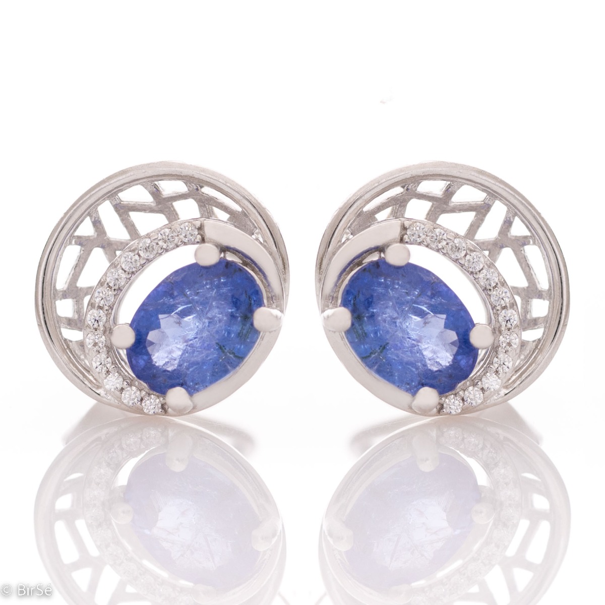 Elegant silver earrings with a modern look and English clasp. Stylish designer craftsmanship from a fine combination of rhodium-plated silver with captivating natural tanzanite. Complete with silver pendant and silver ring from the same collection.