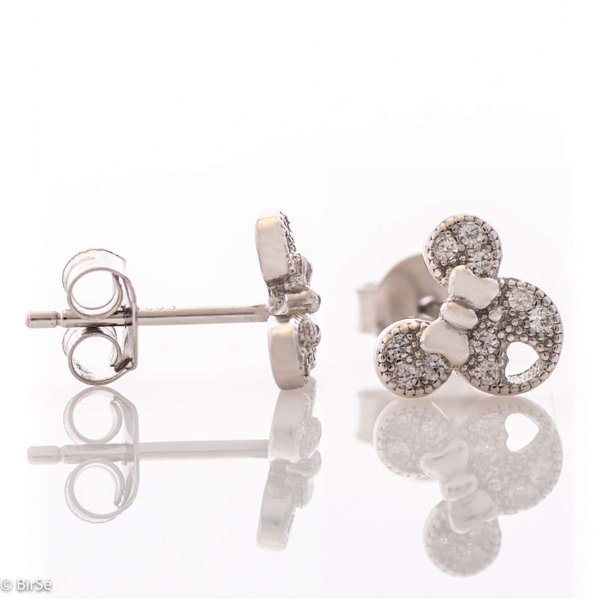 Charming earrings in fine silver in the shape of small ears, decorated with zircons and a delicate ribbon between them. They are suitable for little girls and ladies who have kept their childishness in them.