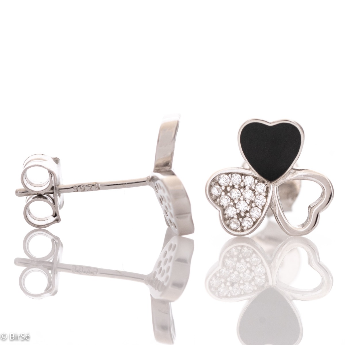 Delicate women's earrings in fine rhodium silver, with an interesting design layout of a charming clover, with black enamel petals and zircons. Featuring a three-leaf clover for luck and happiness, the earrings are a suitable gift for a girlfriend or belo