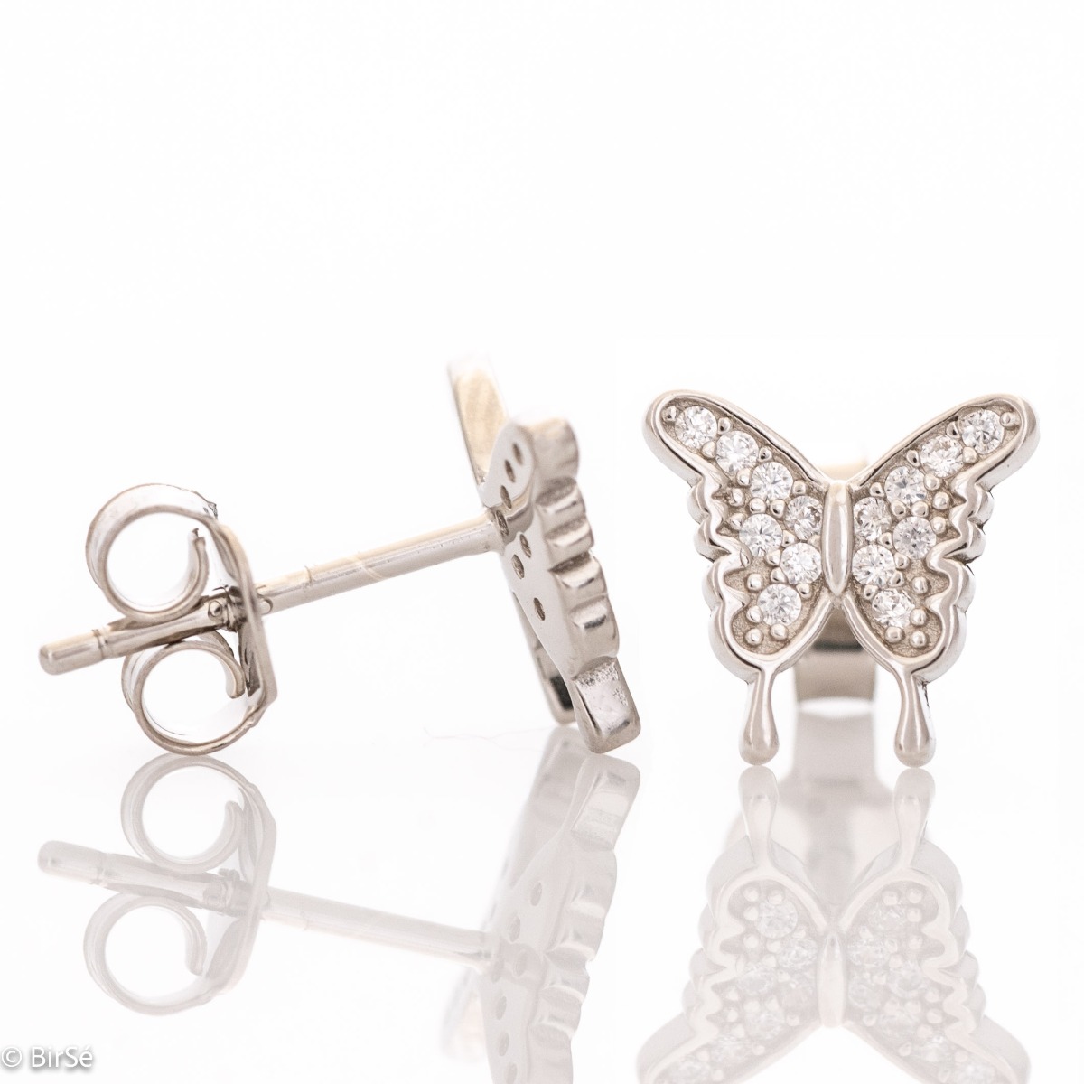 Captivating ladies' butterfly earrings. They are made entirely of rhodium-plated silver and have a convenient pin fastening. They can be combined with a pendant of the same model. Encrusted with sparkling zircons, these earrings make a wonderful gift for 