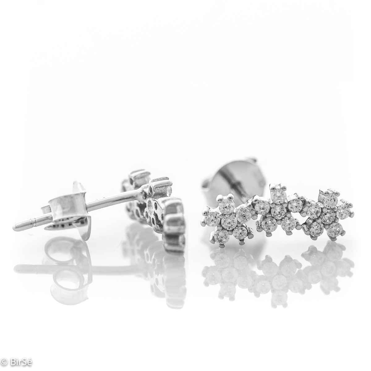 Delicate sterling silver stud earrings with exquisite workmanship entirely in rhodium silver. Three small glittering zirconia flowers fascinate with their beauty and style.