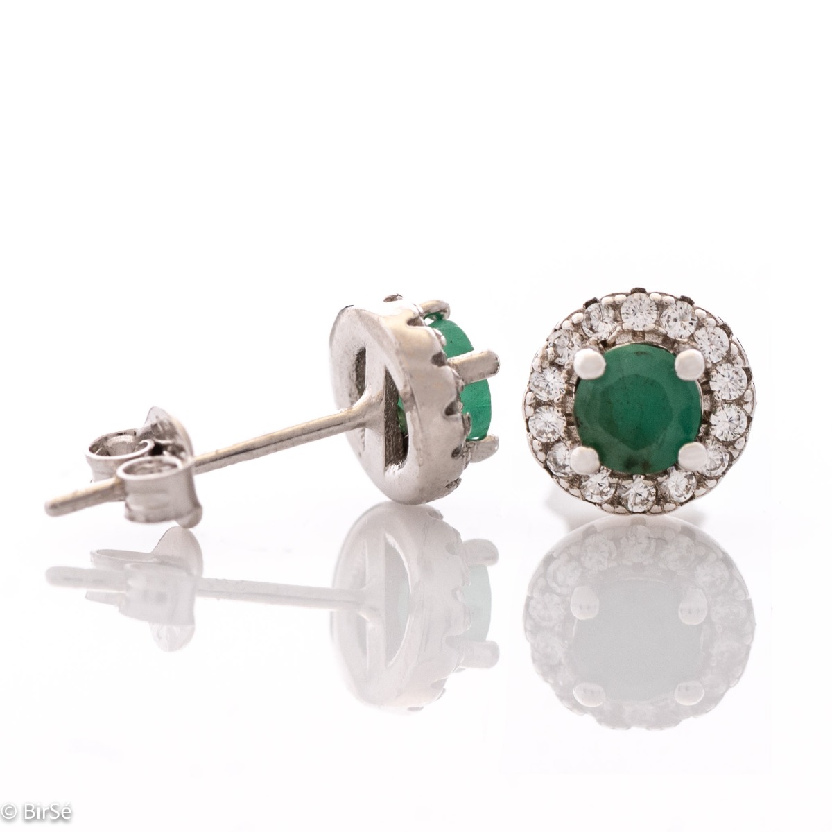 Exquisite beauty - stunning sterling silver earrings with a delicate look and pin fastening. An elegant composition made of a fine combination of rhodium-plated silver with an exquisite emerald and dazzling zircons.