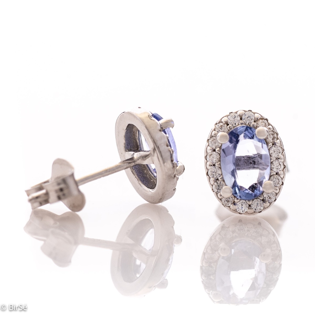 Royal vision - stunning silver earrings with a spectacular look and stud fastening. An elegant composition made of a fine combination of rhodium-plated silver with exquisite tanzanite and dazzling zircons.