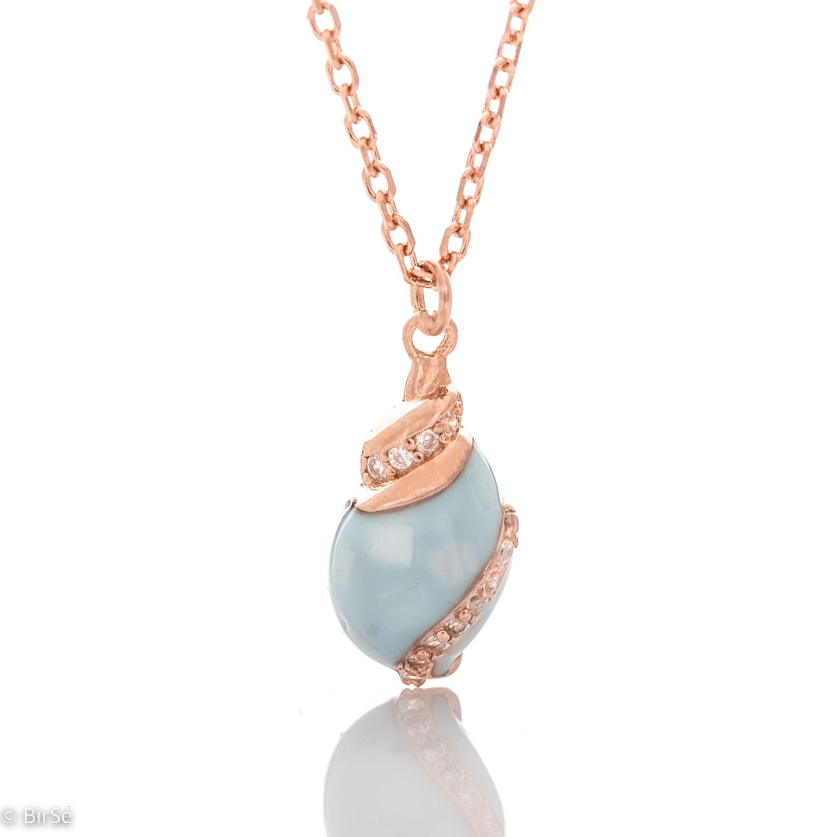 Delicate women's necklace with a delicate rose silver pendant design. The jewelry features an elegant chain holding an exotic element with a captivating sea blue opal and added fine zircons.