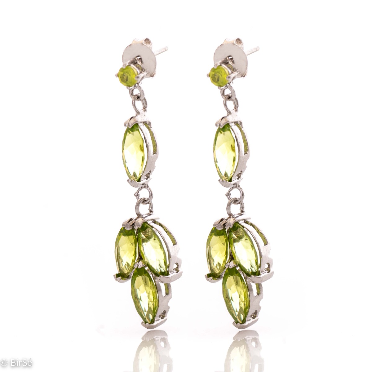 Beautiful rhodium-plated sterling silver and soft green peridot earrings. Charming jewelry for ladies with lovely green eyes.