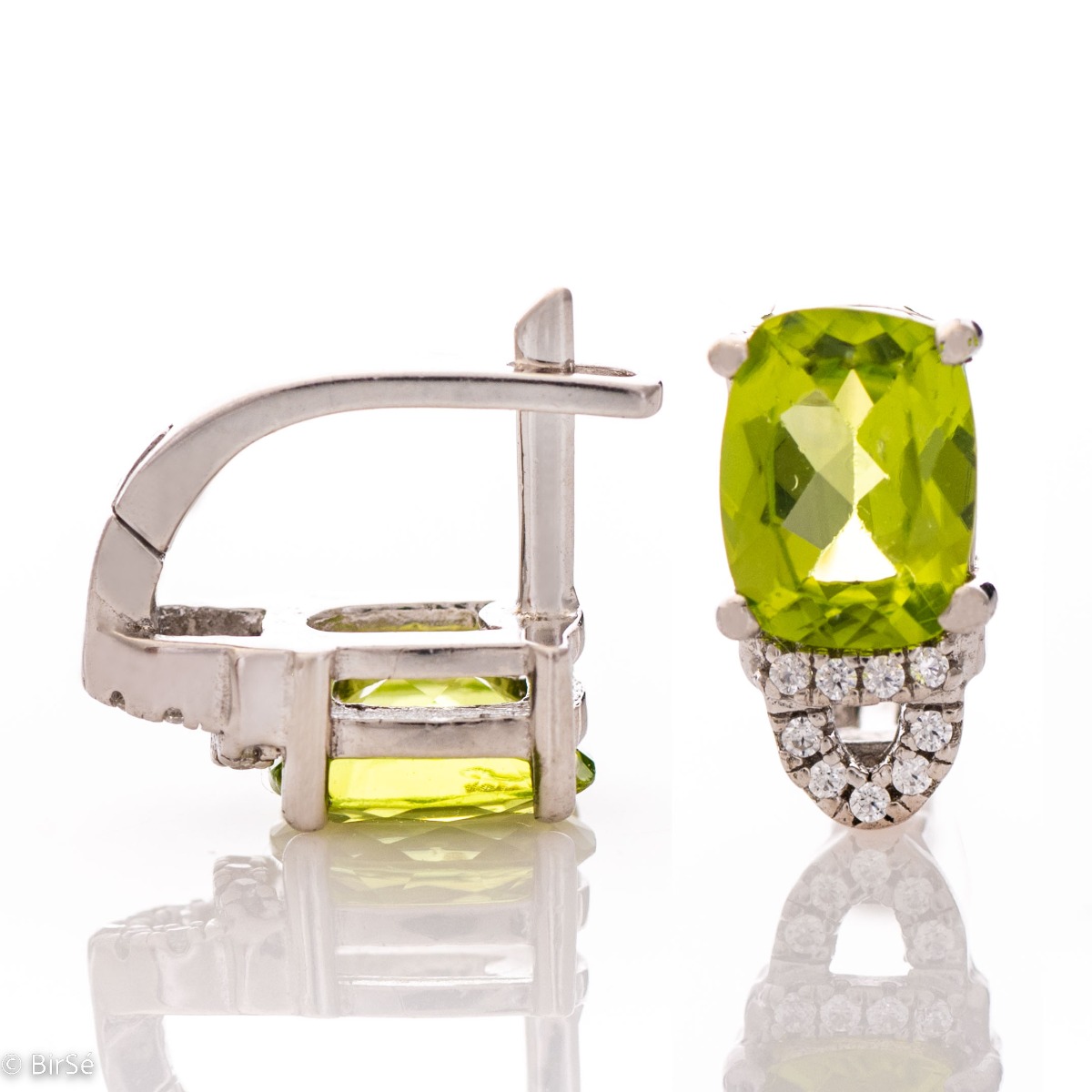 For the gallant ladies with elegant taste and style, our rhodium silver and natural peridot earrings will complement any outfit perfectly. You can match them with a ring from the same collection.