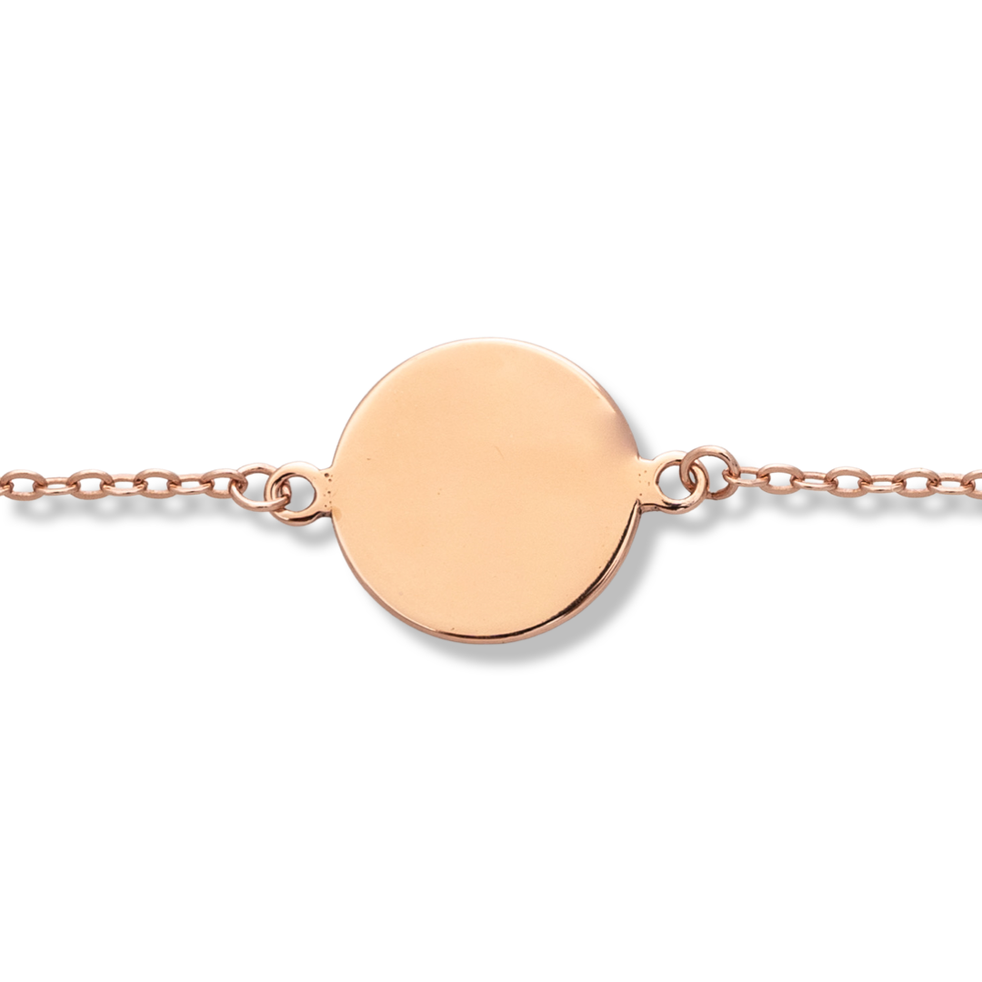 A simple round shape bracelet in shiny rose silver with a tile. The jewelry makes a great gift and allows for engraving a letter or the date of an event.