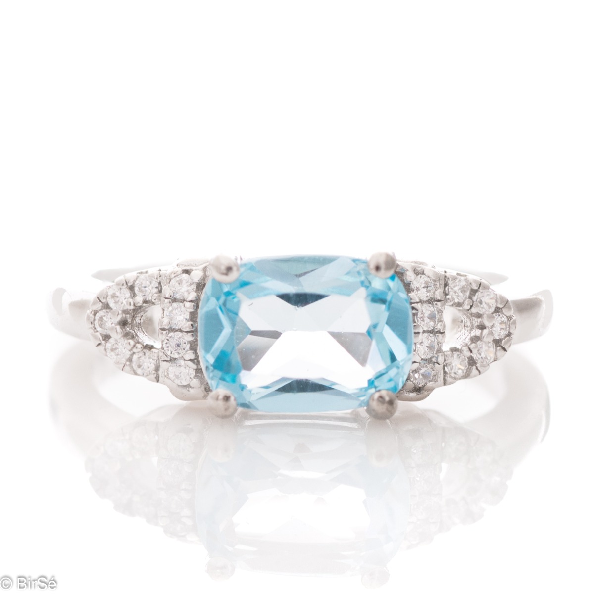 Tempting Ring of Rhodised Silver with Enchanting Blue Topaz and Fine Zircons 1,60 ct.