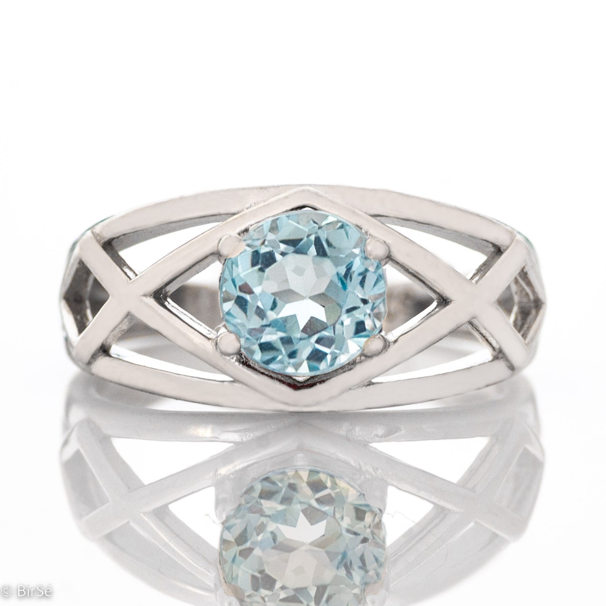 Delightful rhodium silver and natural blue topaz ring. The seductive charm of the stone can captivate any stylish and sophisticated lady