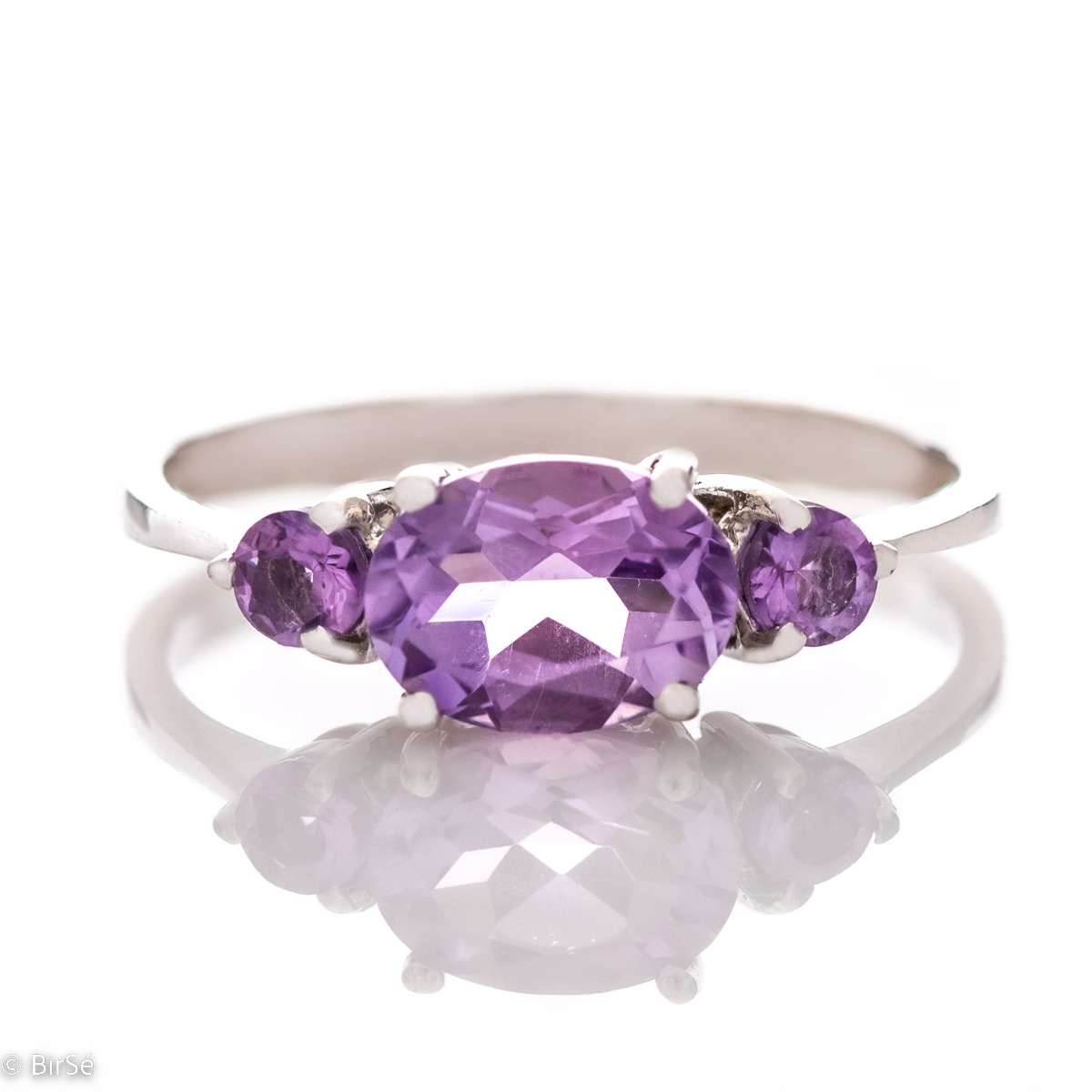 A stylish new offering for your jewelry collection. A ladies' ring made entirely of fine rhodium silver that gently envelops a magnetic amethyst.