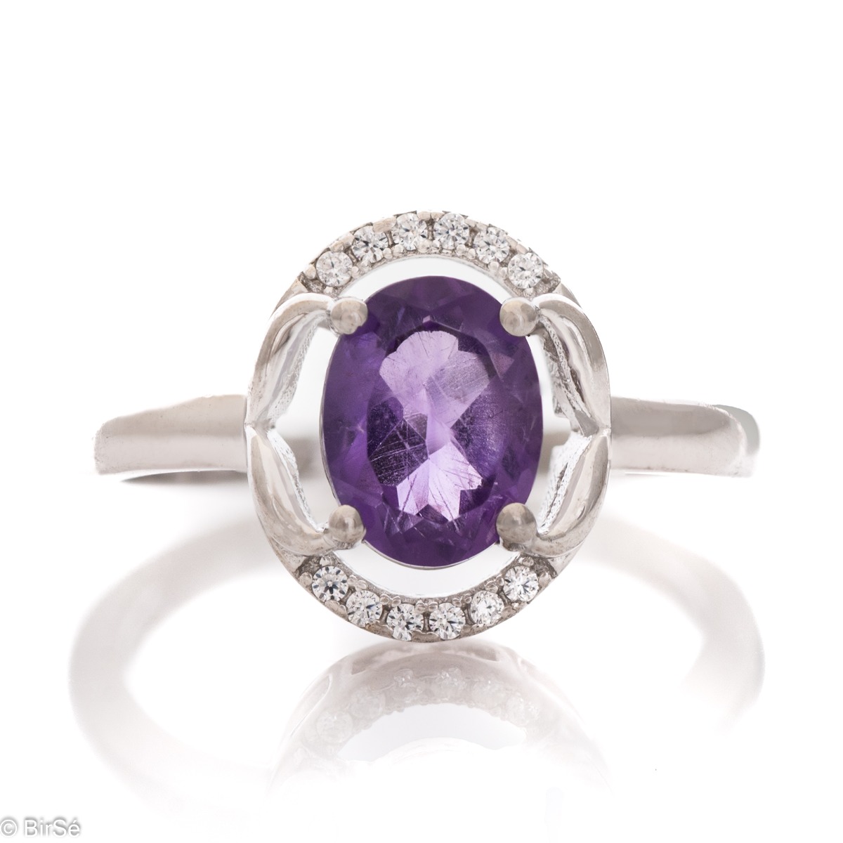 An elegant women's ring, shaped in oval elements and a gentle, beautiful look. Stylish craftsmanship from a fine combination of rhodium silver, zircons and natural amethyst. Complete with the same model of charming English clasp earrings.