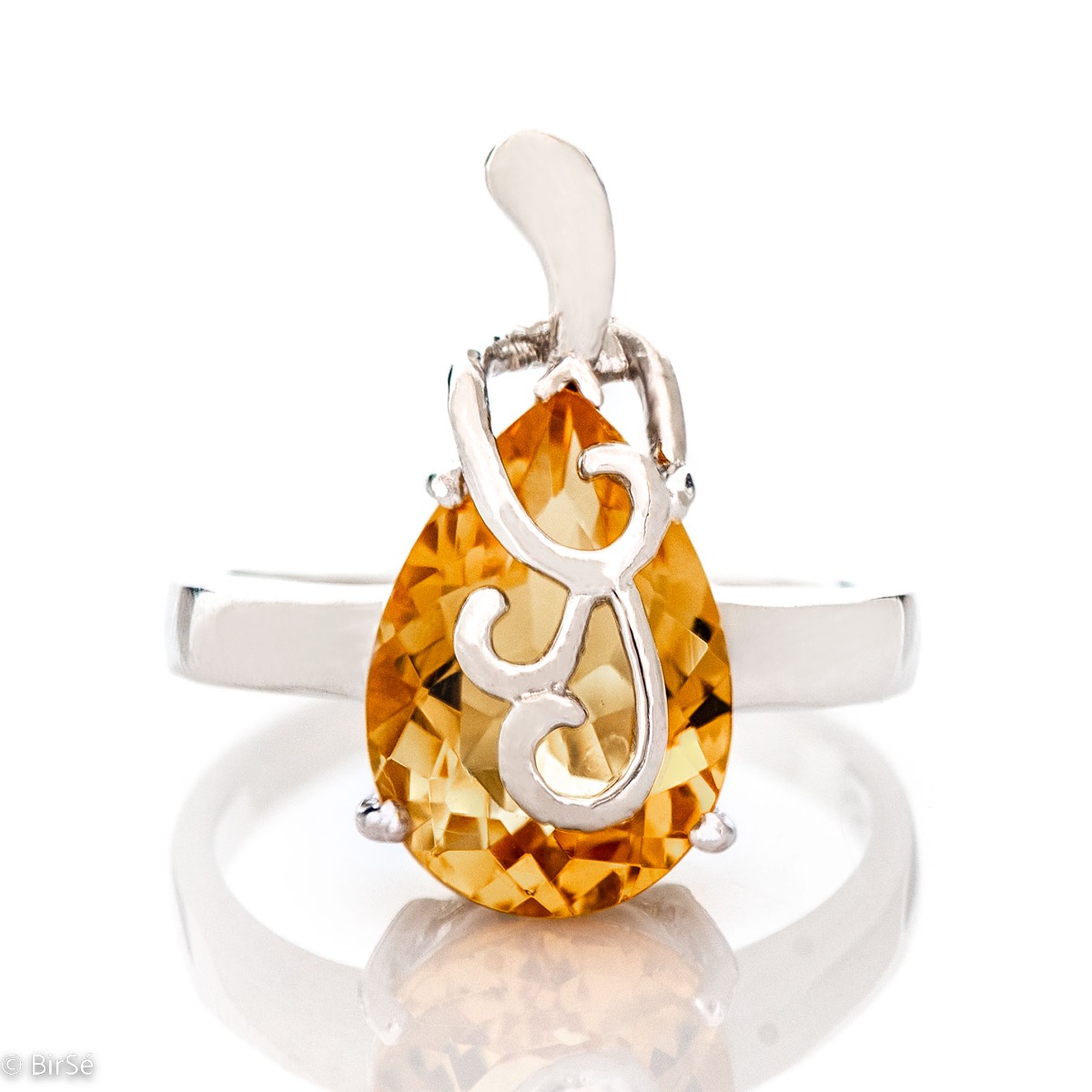 The gentle glow of a natural citrine stone, complemented by a glamorous, elegant and fine craftsmanship made entirely of beautiful rhodium silver - our new offering for women's ring, part of a charming set of pendant and dangle earrings.