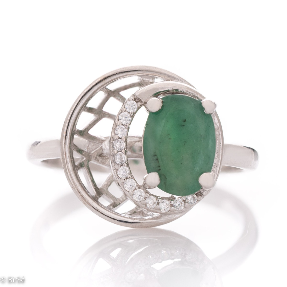 An elegant women's ring with ethereally shaped details, made entirely of rhodium-plated silver in combination with exquisite zircon stones and a captivating emerald.