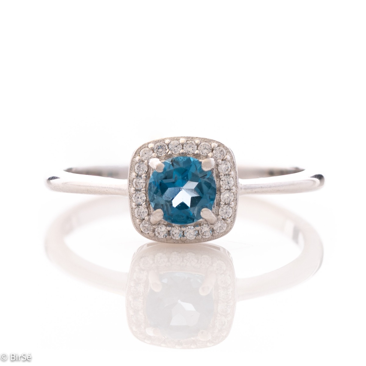 An elegant women's ring with extremely delicate details made of rhodium silver, natural London topaz and sparkling zircon stones. It is suitable for combining in a set with earrings and a pendant from the same collection and the same unique design.