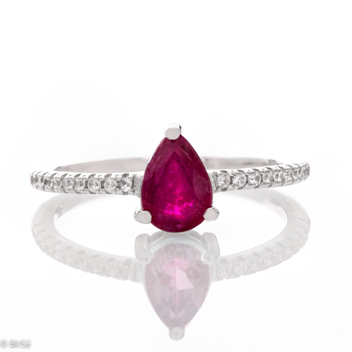 Exquisite Ring of Rhodised Silver with Drip-Shaped Ruby and Enchanting Zircons 0,75 ct.