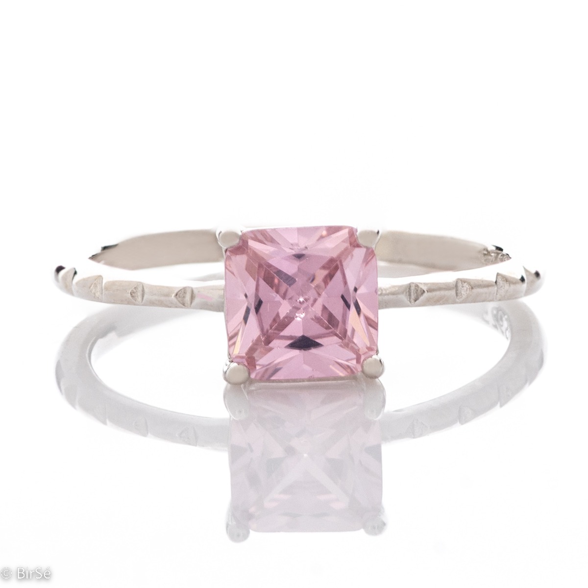 Delicately elegant women's ring with exquisite pink zircon. Stylish layout of the details and shapes from fine rhodium silver.