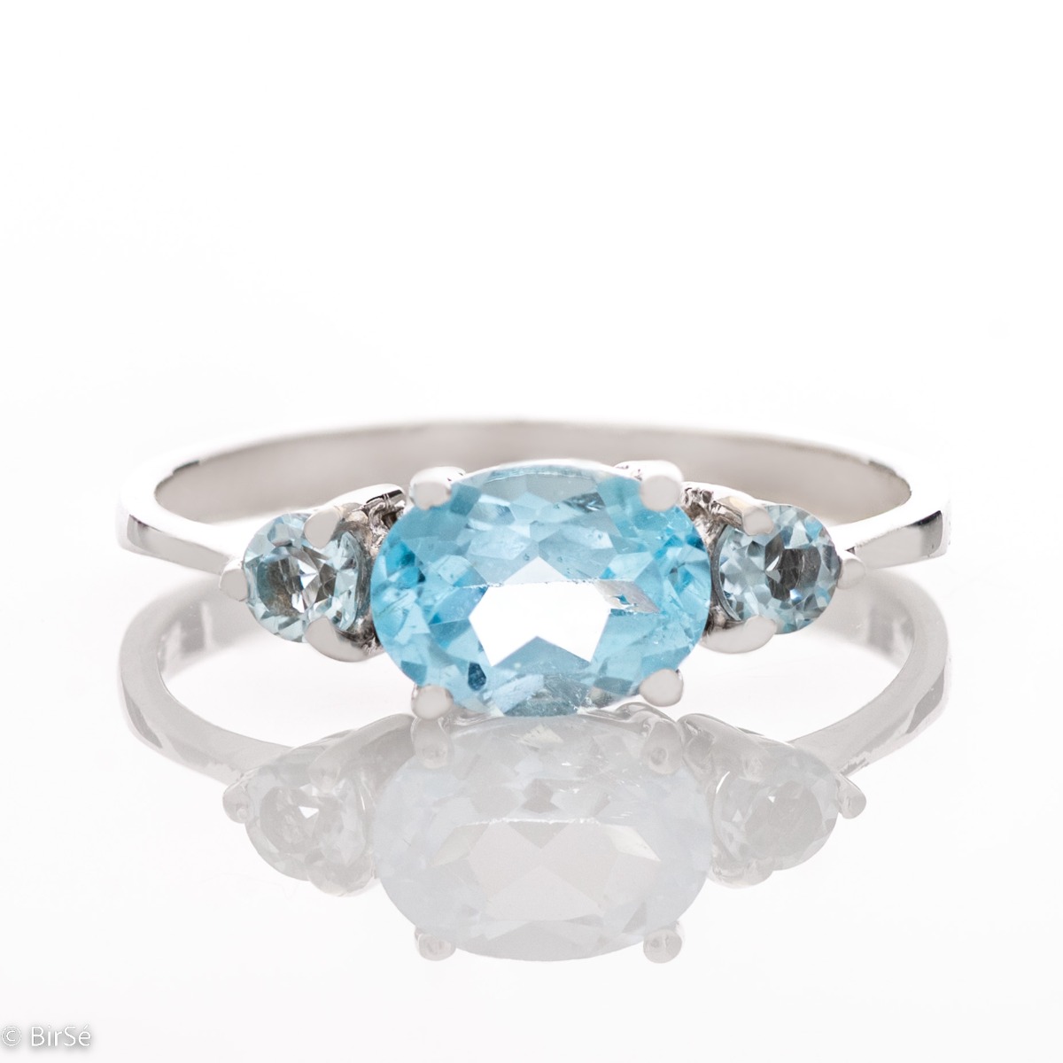 A stylish new offering for your jewelry collection. A ladies ring made entirely of fine rhodium silver that gently envelops a dazzling blue topaz.