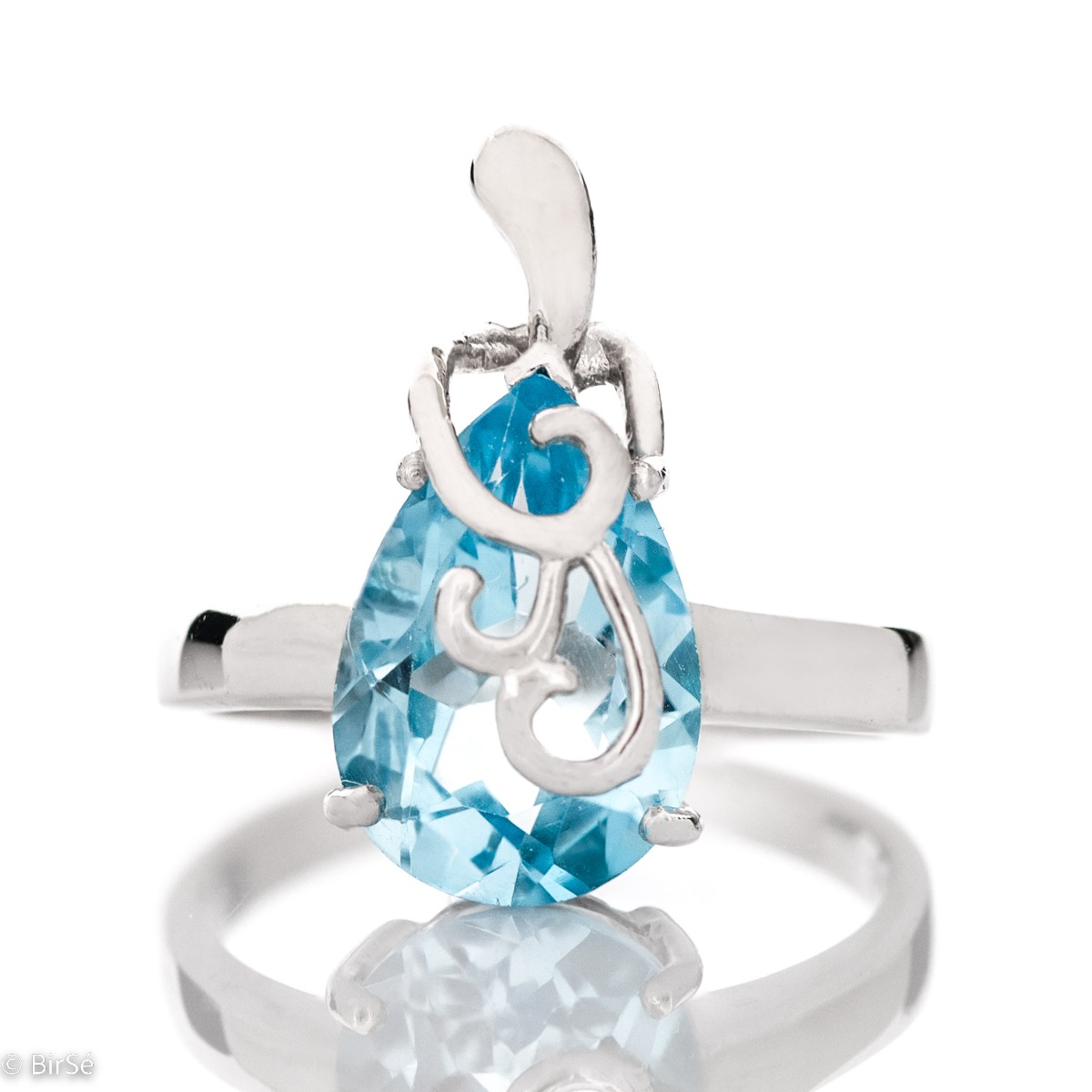 An elegant women's ring with a charming and radiant natural blue topaz in a delicate teardrop shape and precise craftsmanship combining fine curves and rhodium-plated silver. It can be combined with a pendant and earrings of the same model.