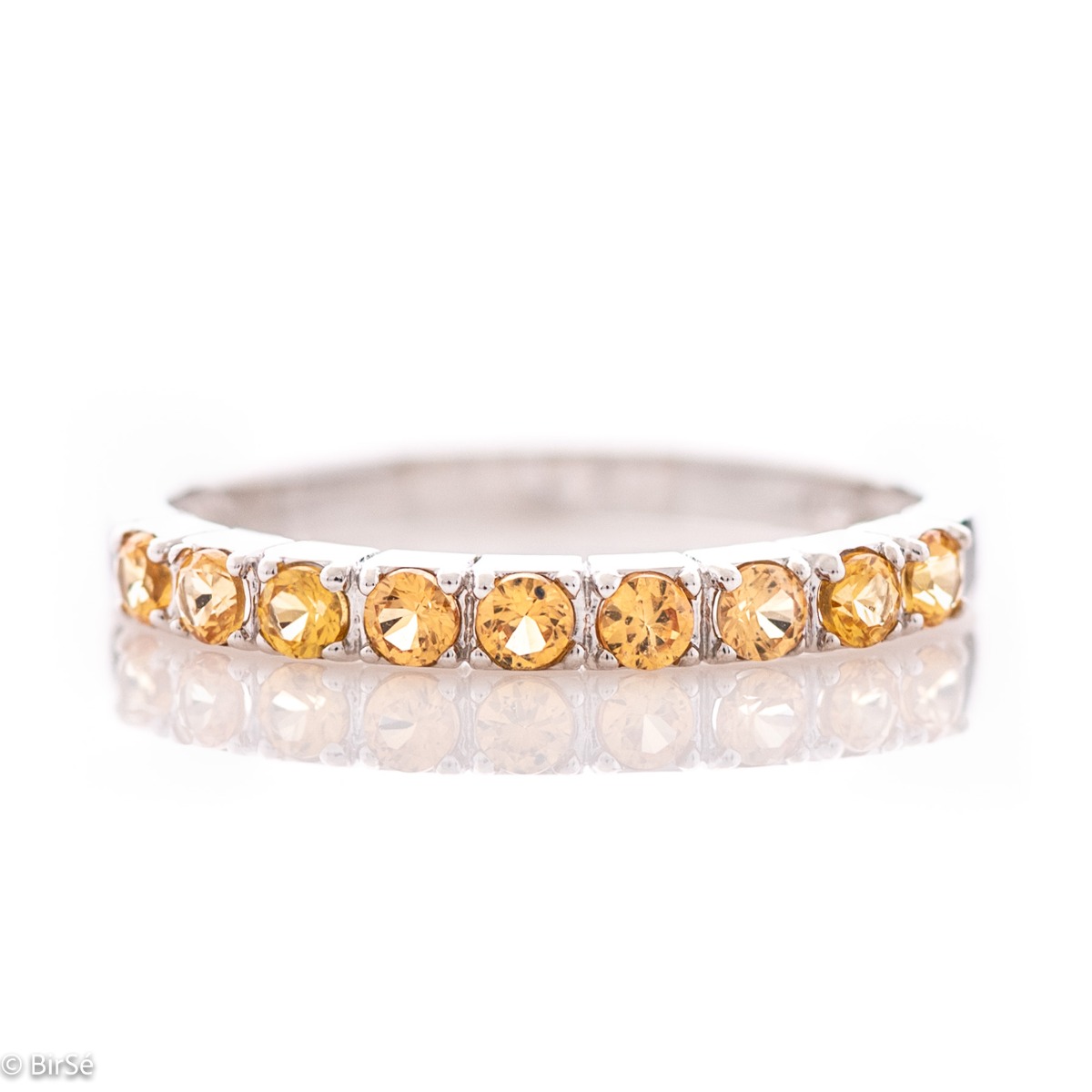 A delightfully charming ring in exquisite rhodium-plated silver with a row of enchanting citrine stones.