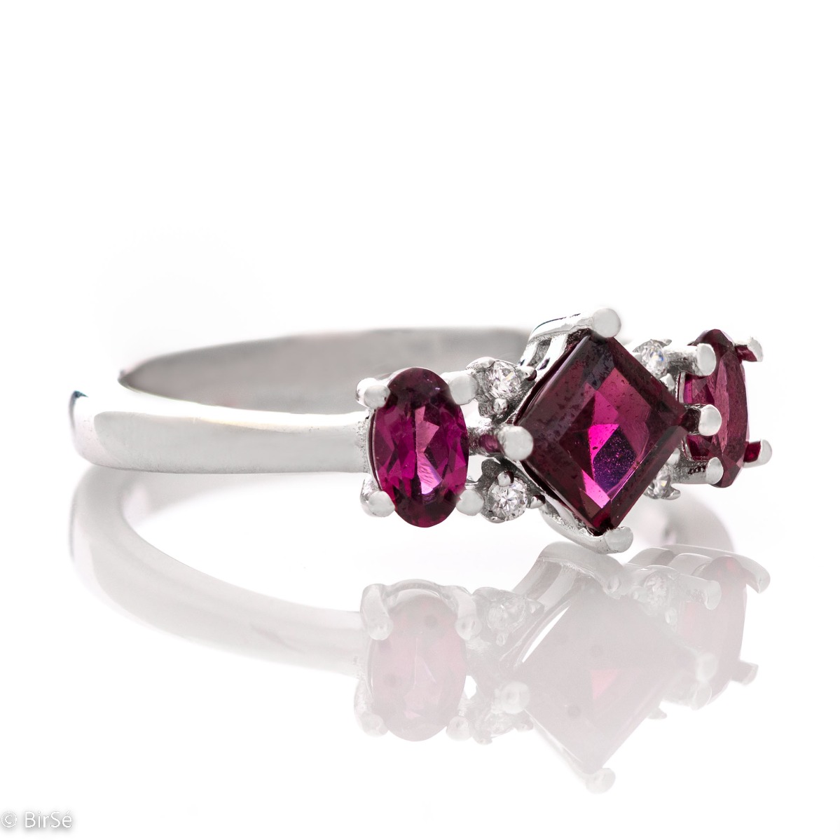 Spectacular, exquisitely crafted ring of rhodium-plated silver and natural rhodolite stones, in the refined mining of delicate zircons. Part of a charming set with stylish pendant and earrings from the same collection.