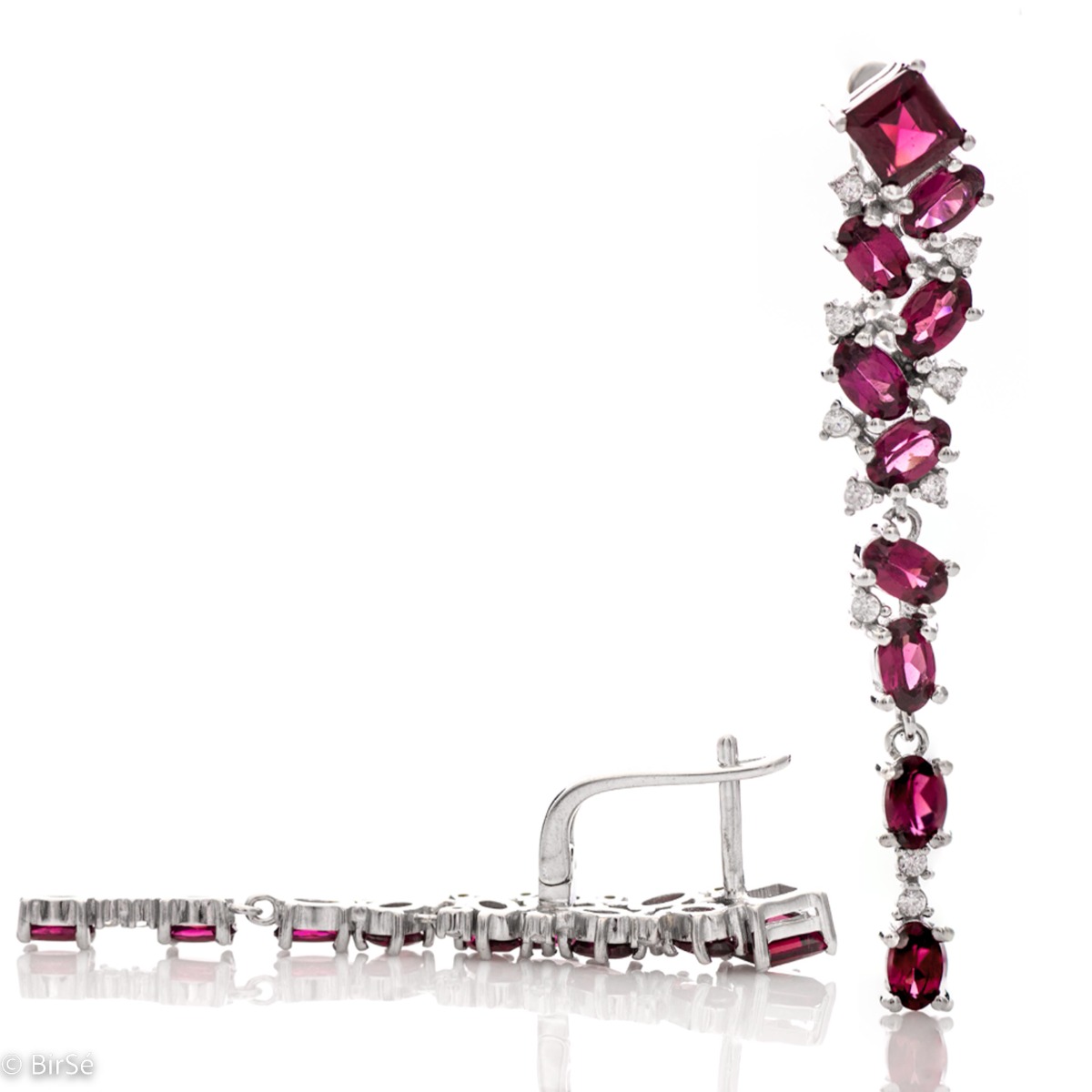 Elegant women's earrings with English clasp, a beautiful waterfall of numerous natural rhodolite stones, complemented by delicate zircons and a sophisticated design in rhodium silver. In an exclusive pendant and ring set.