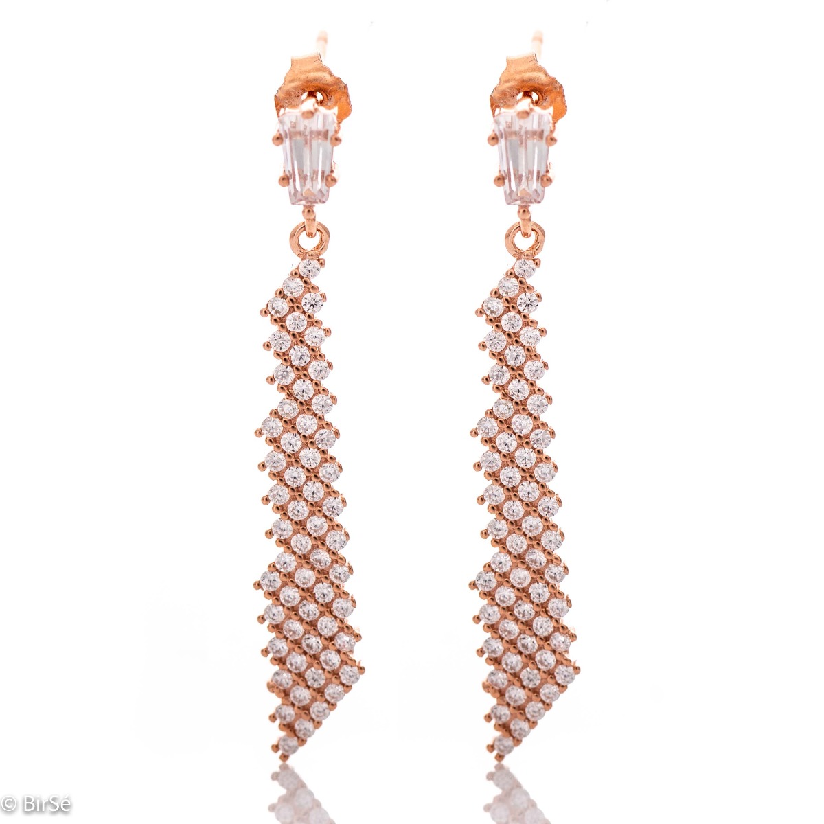 Elegant earrings with a stylish design - a fine network of rose silver, decorated with sparkling zircons. A charming baguette-shaped zircon conceals a pin fastening, favored by ladies as comfortable and practical.