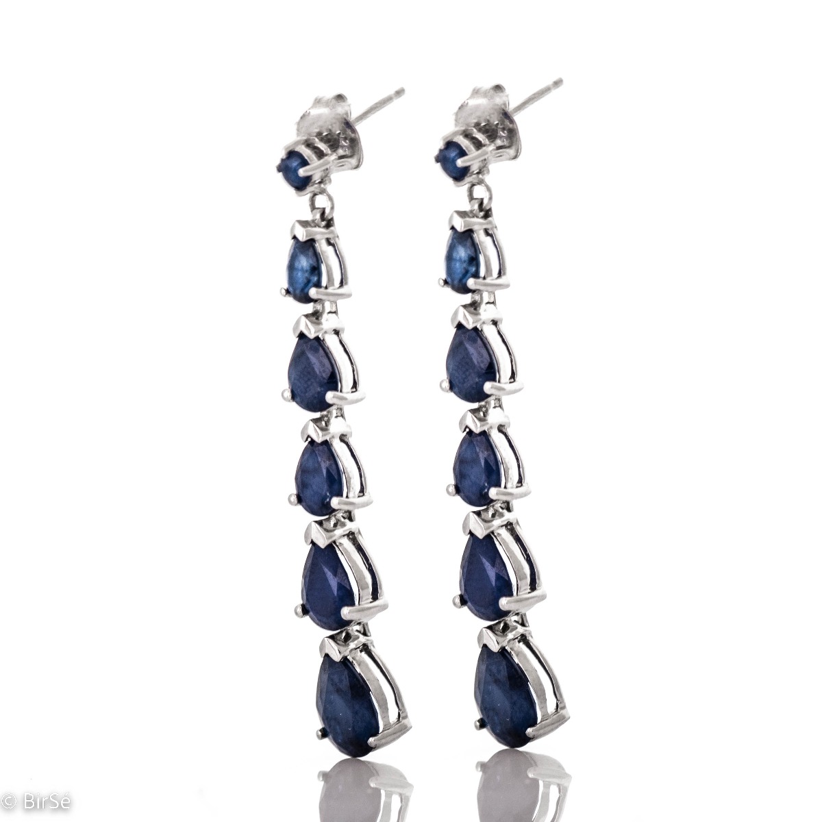 Beautiful and dazzling, rhodium silver and natural teardrop sapphire earrings will add sophisticated style to your look.