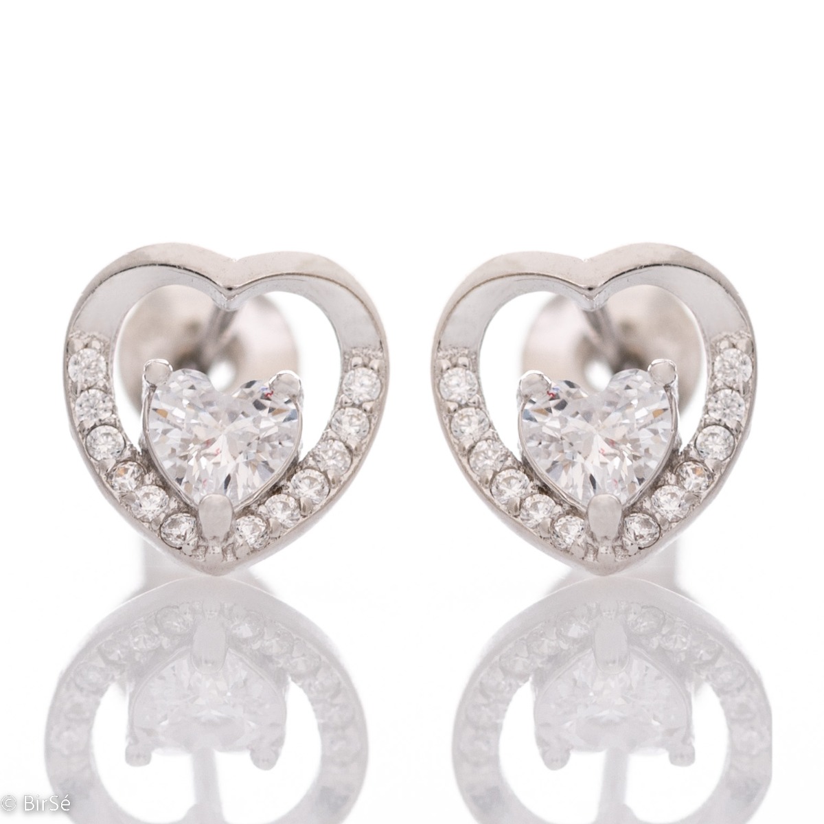 Exquisite heart-shaped sterling silver earrings delicately encase a smaller sparkling cubic zirconia heart. Fastening with a pin is for more convenience, and the earrings are a suitable gift for the beloved girl