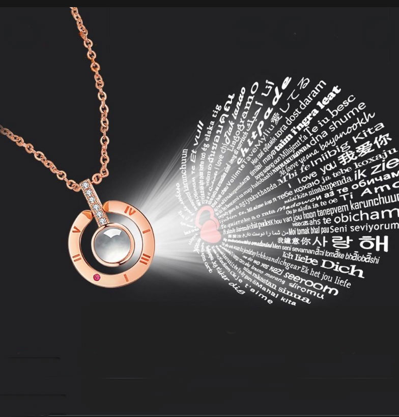 Delightful craftsmanship of rhodium silver heart shaped necklace. A unique stone adorns the center of the heart and upon its illumination, the magic of love will wash over you in 100 languages. There is no better way to say "I love you" x 100.