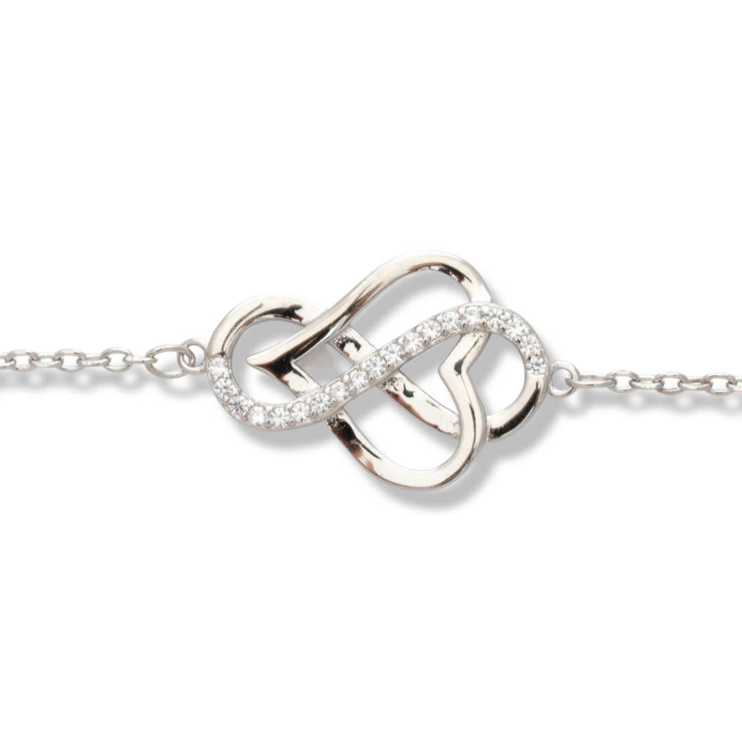 The magic of love in an exquisitely crafted sterling silver bracelet with an intertwined heart and infinity. Captivating zircons on infinity make the jewelry even more charming. A sophisticated proposal from BirSe for your special moments.