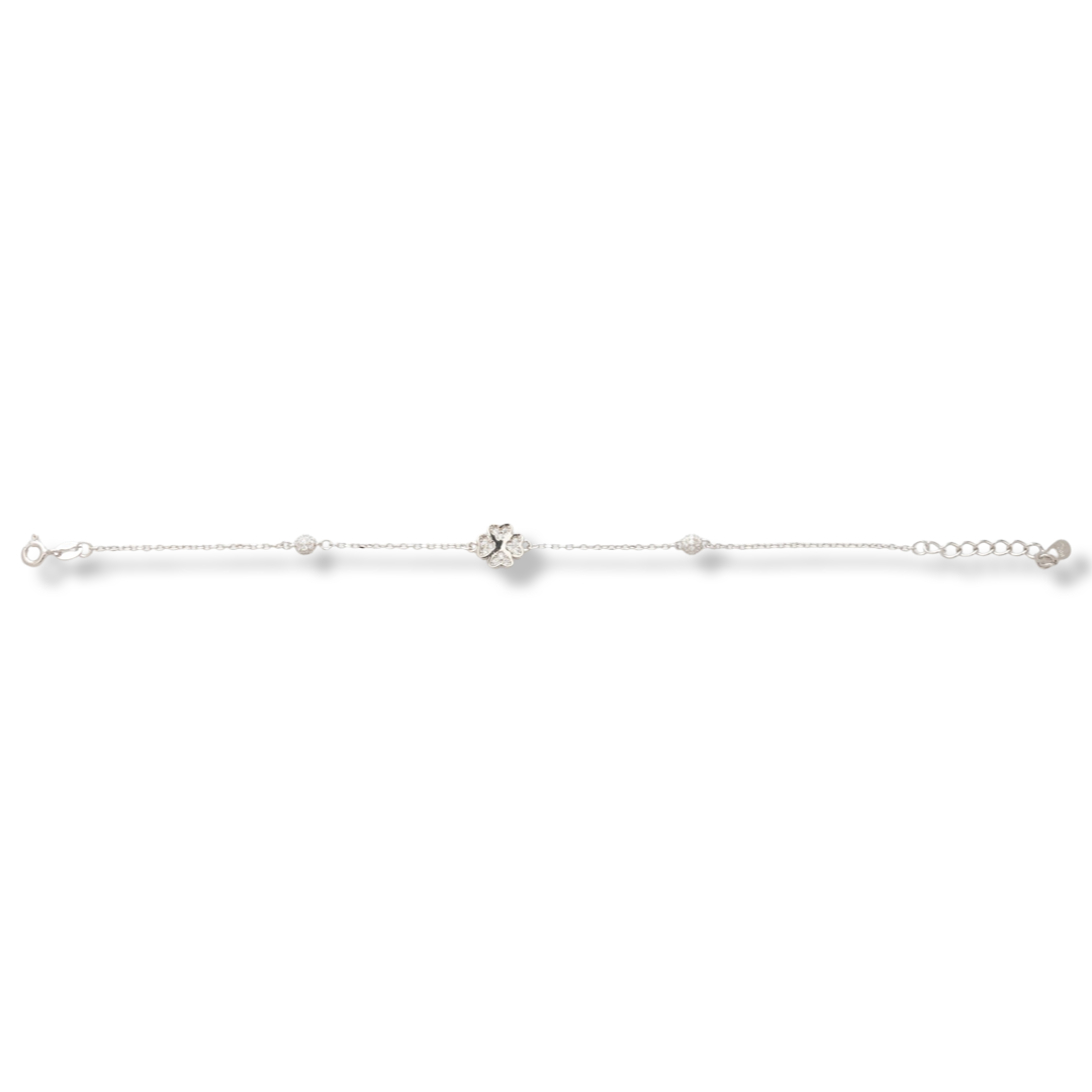 Delicate women's bracelet in rhodium-plated silver with an elegant clover, decorated with sparkling zircons. On the fine chain are added balls, also with zircons for more shine of the jewel. The bracelet has an extension, for convenience when adjusting th