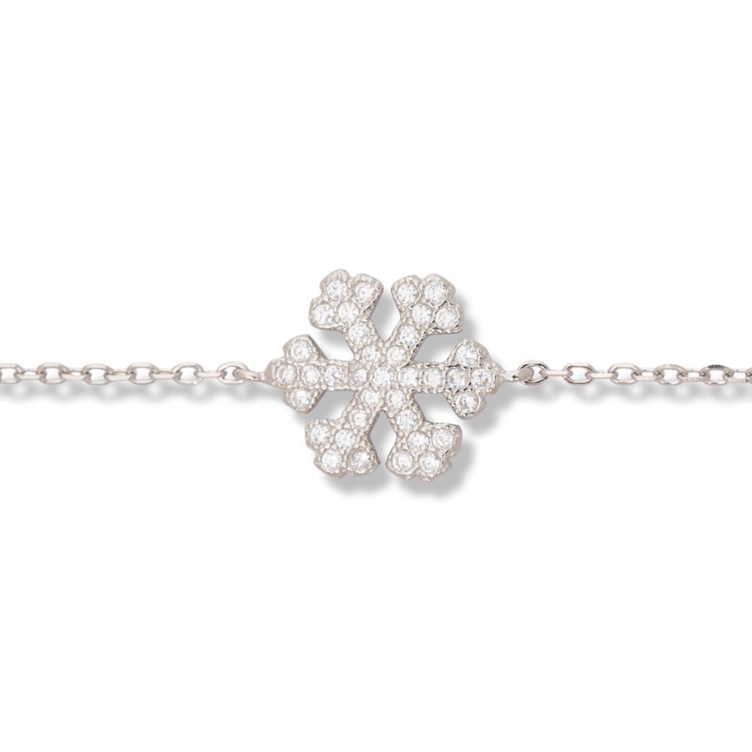 An elegant bracelet in fine rhodium silver with an exquisite snowflake design, beautifully encrusted with sparkling zircons. The bracelet has an extension for convenient length adjustment.