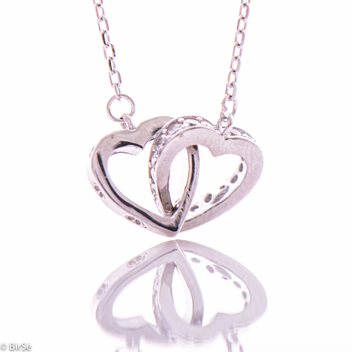 A rhodium-plated silver necklace with a delicate shape of intertwined hearts and a stylish design of side-mounted zircons.