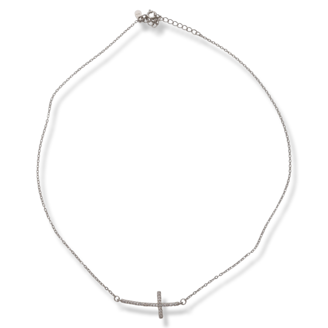 Stylish women's necklace, with refined craftsmanship and modern rhodium-plated silver design. A spectacularly shaped cross, placed horizontally and caught by a delicate chain of classic type, shines in all its splendor from the white zircons covering it.