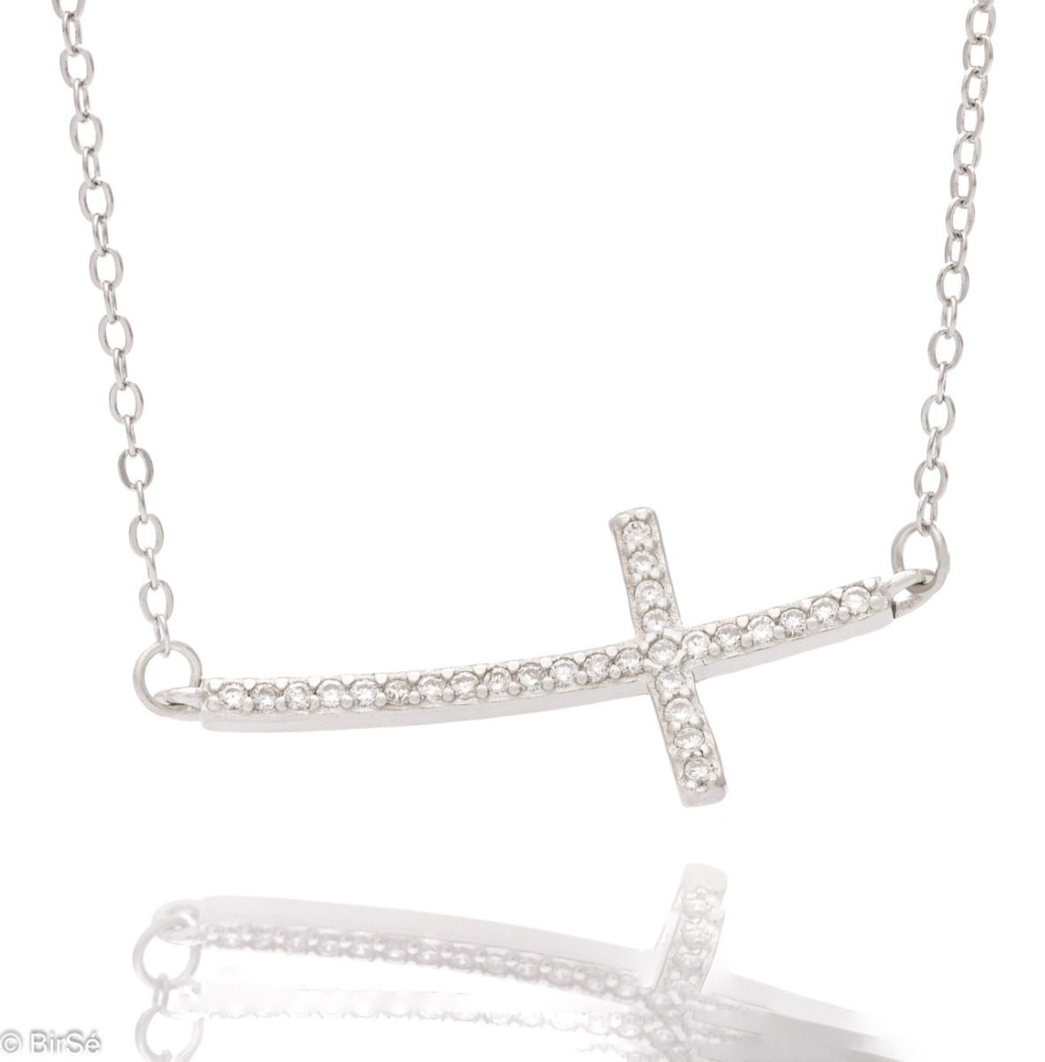 Stylish women's necklace, with refined craftsmanship and modern rhodium-plated silver design. A spectacularly shaped cross, placed horizontally and caught by a delicate chain of classic type, shines in all its splendor from the white zircons covering it.