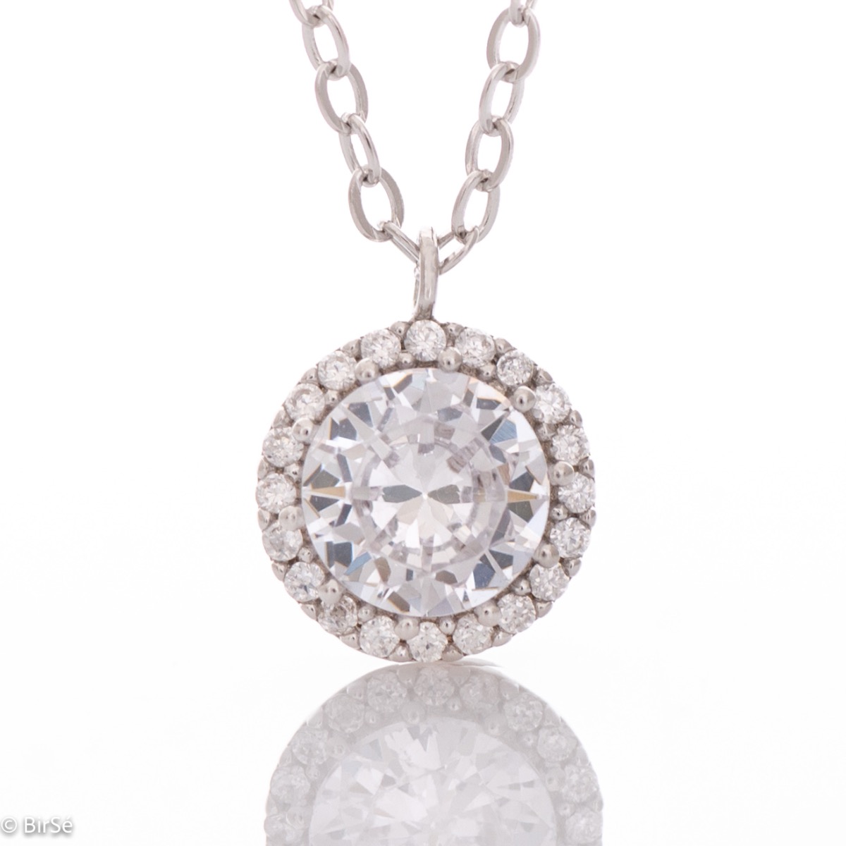 A simple refined necklace made of rhodium-plated silver and a beautiful shiny zircon, beautifully surrounded by many tiny zircons. It is suitable for ladies who like clean lines in jewelry. It can be combined with earrings and rings with zircons.