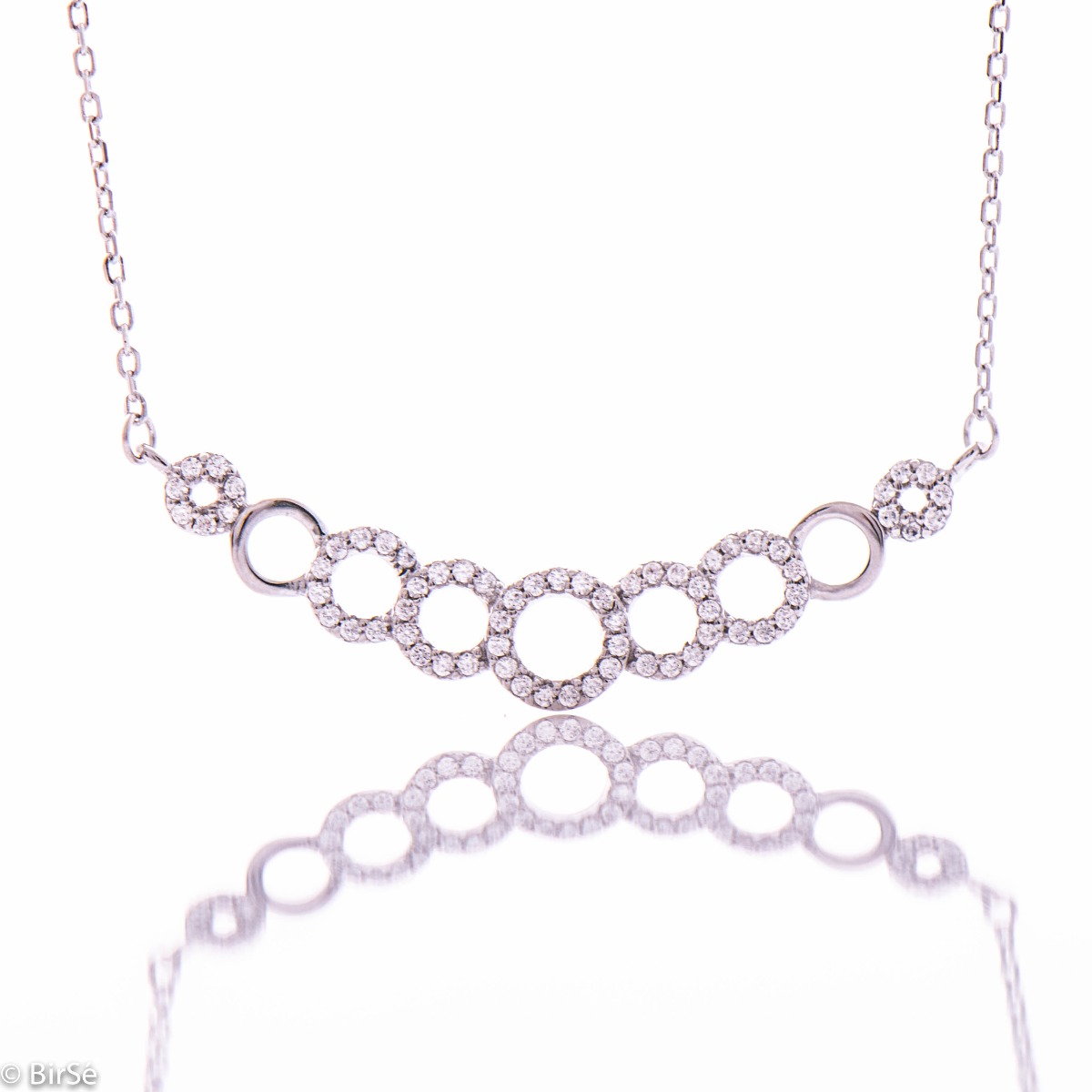 Elegant women's necklace in a modernistic and innovative layout of geometric elements in the shape of an ellipse. Stylish and delicate craftsmanship of the details from a combination of classic silver and exquisite zircon stones.