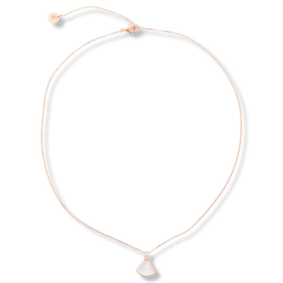 A charming delicate necklace with an elegant design, made entirely of fine rose silver and beautiful mother-of-pearl. A dainty zircon is added to complete the perfection.