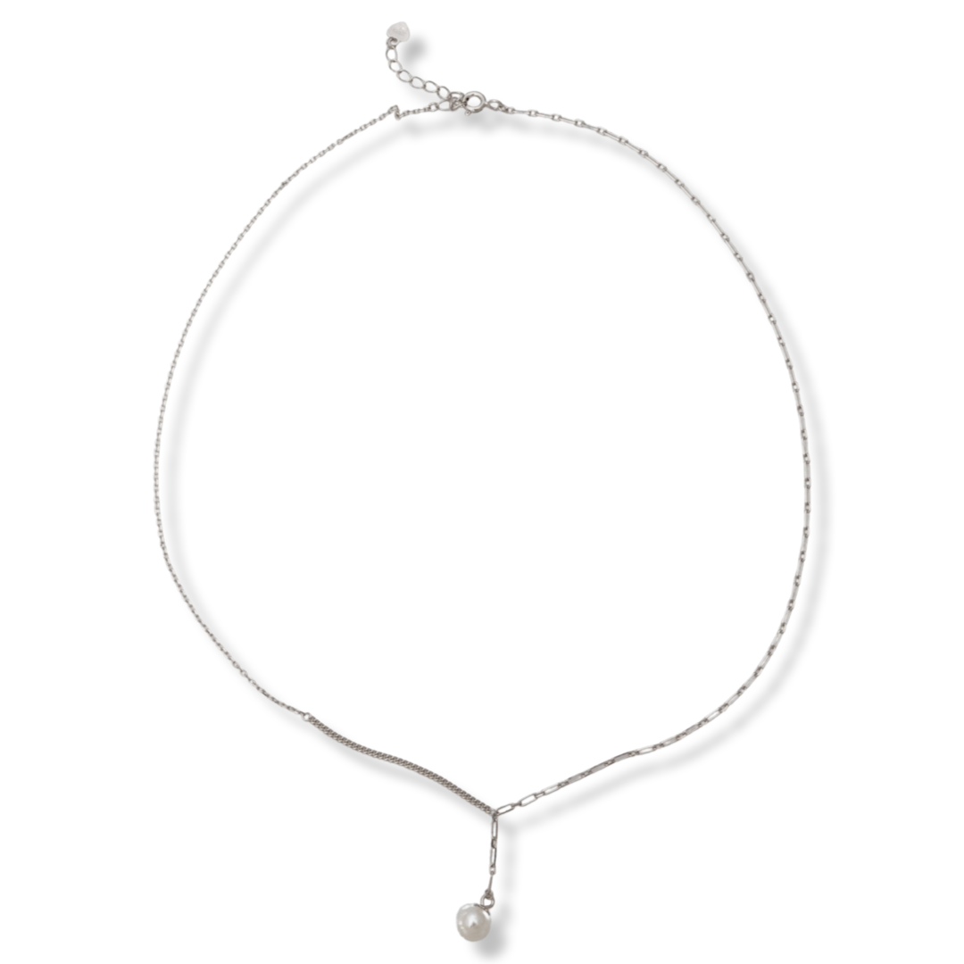 A non-standard necklace model, a combination of two types of knitting, beautifully combined in a jewel. The main accent is a delicate white pearl, elegantly attached at the end of the chain. The necklace can be paired with earrings and a pearl bracelet.