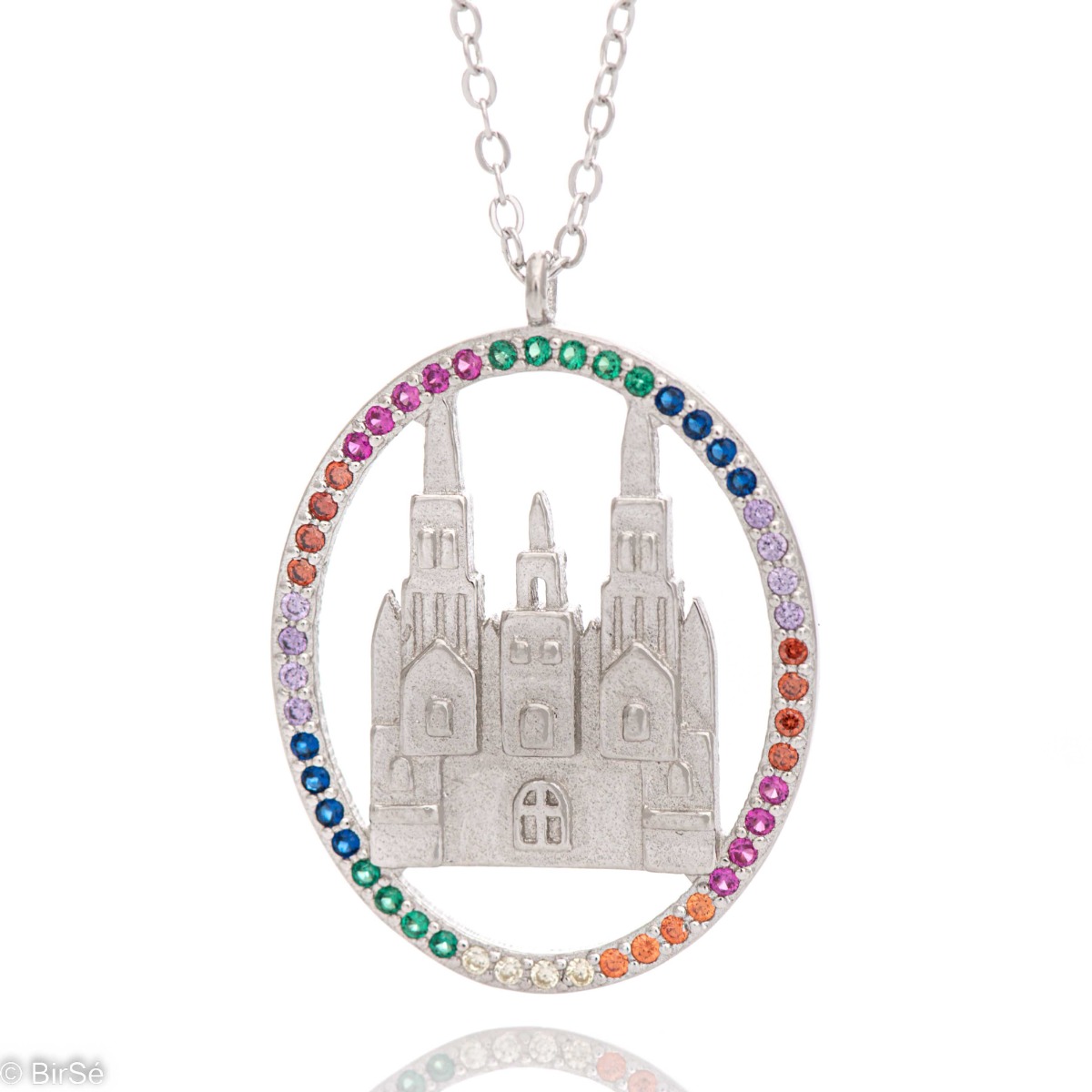 A spectacular locket made of rhodium-plated silver with the image of a castle, elegantly surrounded by a halo of multi-colored zircons. Jewelery for extravagant ladies.