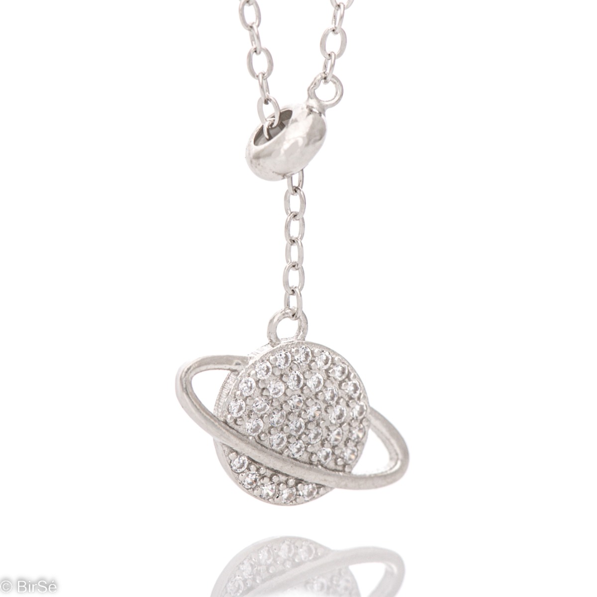 A spectacular necklace, elegantly shaped from soft rhodium-plated silver with the participation of sparkling zircons forming an exquisite planet. The necklace has an additional chain for changing the length.